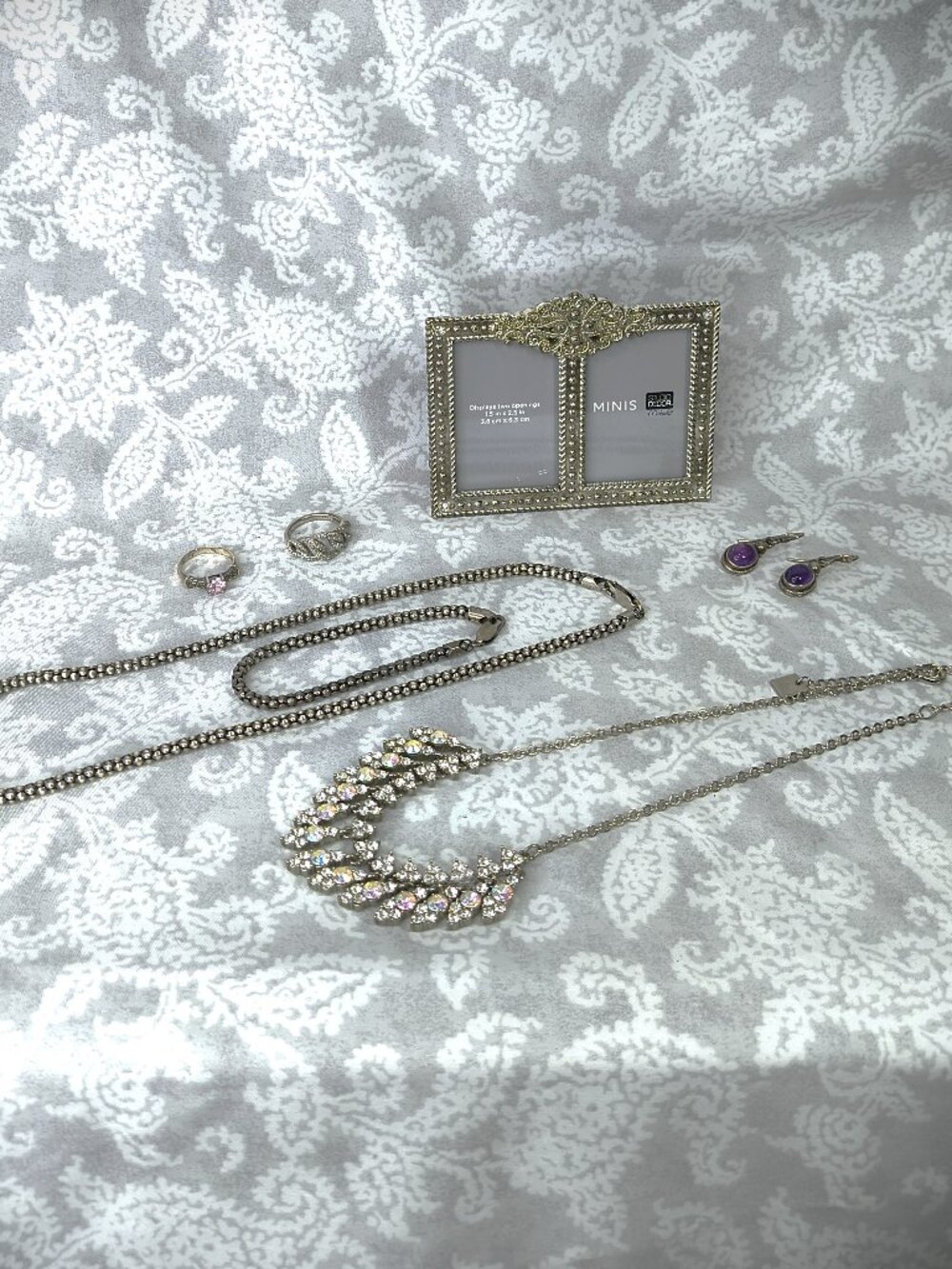 Lot of ornate mixed silver & silver tone jewelry with mini dual picture frame